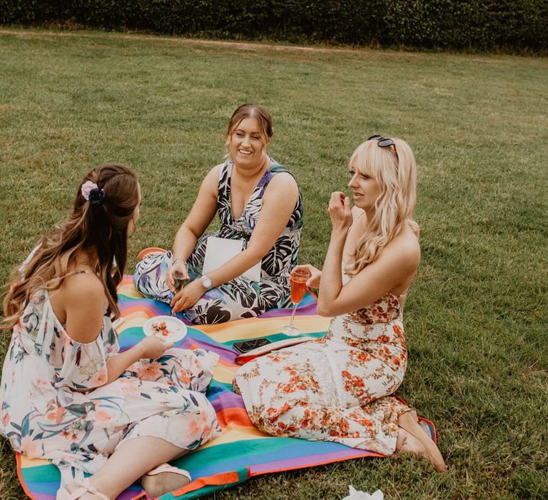 guests sitting of picnic blankets