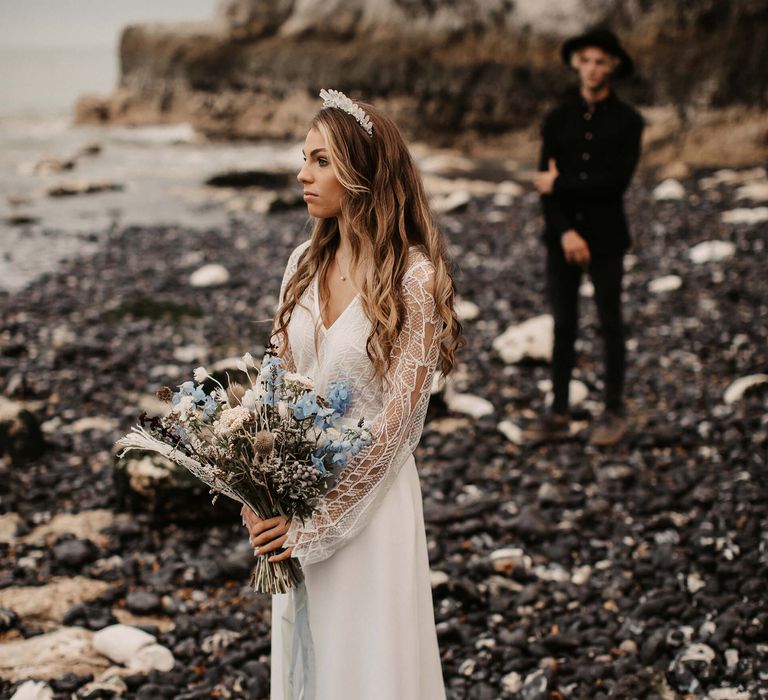 Bride and groom first look at the beach 