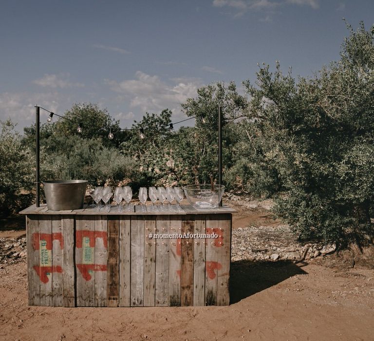 Fresh beer at boho wooden drinks bar for wedding reception