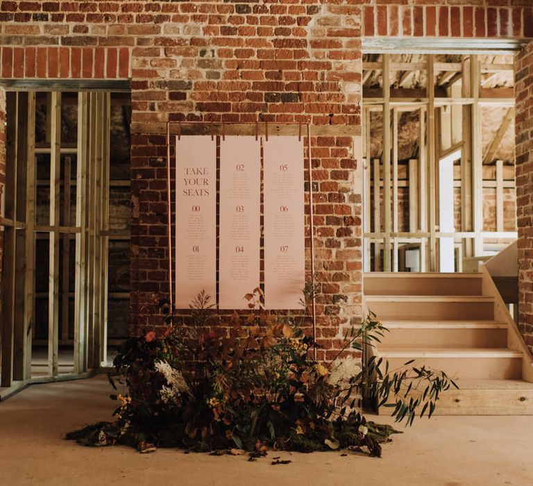 Rustic wedding sign in Reymerston Hall barn