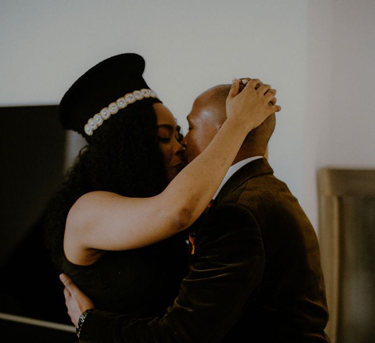 Bride and groom kissing on the wedding morning 