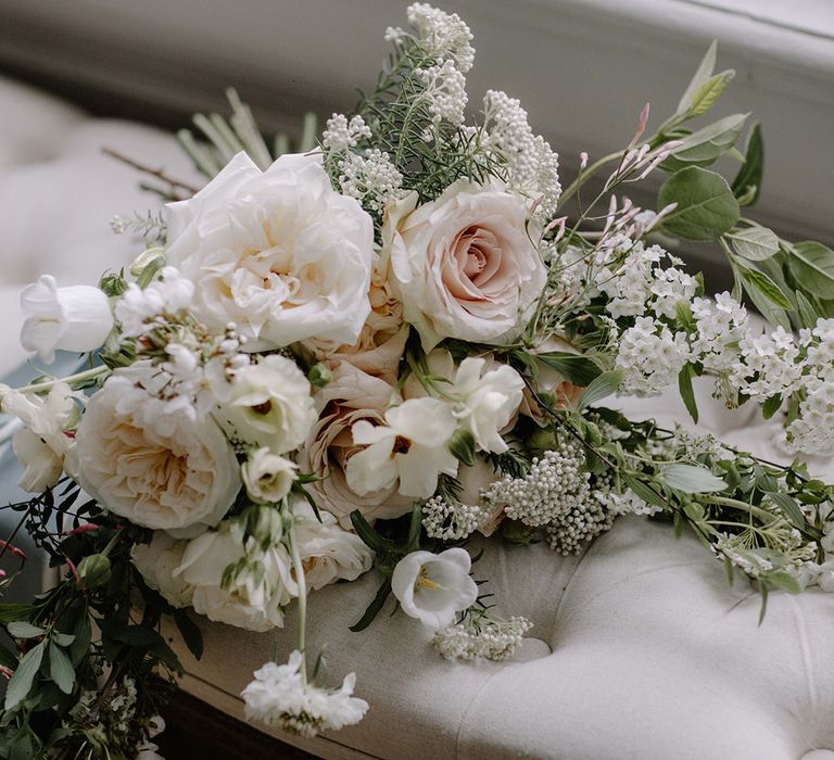 White and blush roses, with locally foraged foliage and wildflowers for a rustic French bouquet