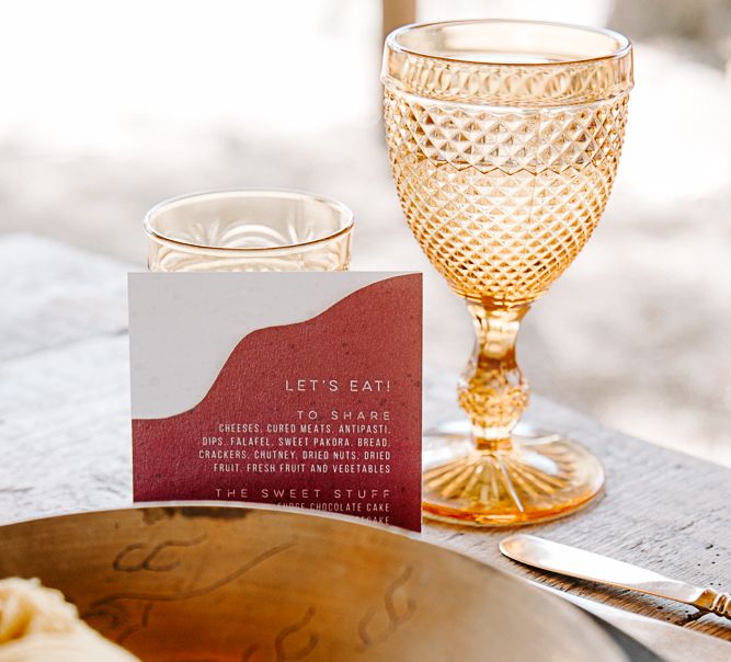 Orange wine glasses complete with Chloe Ainsley Creative stationery 