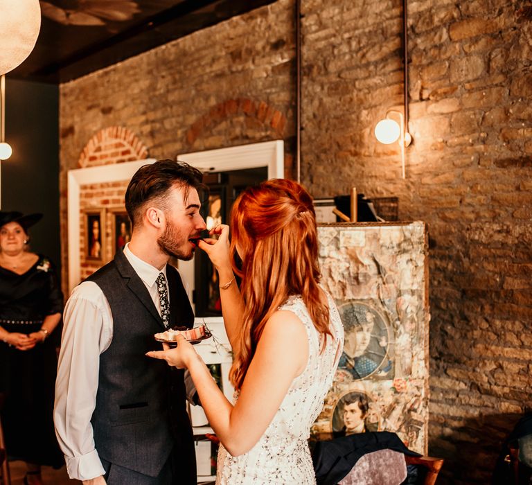 Bride & groom kiss during wedding reception