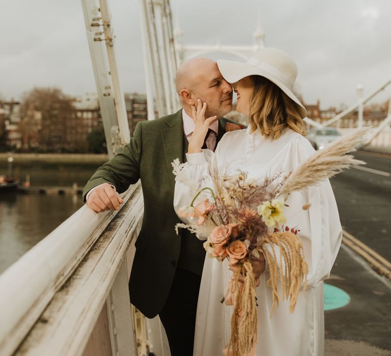 Bride & groom walk across bride in London together 