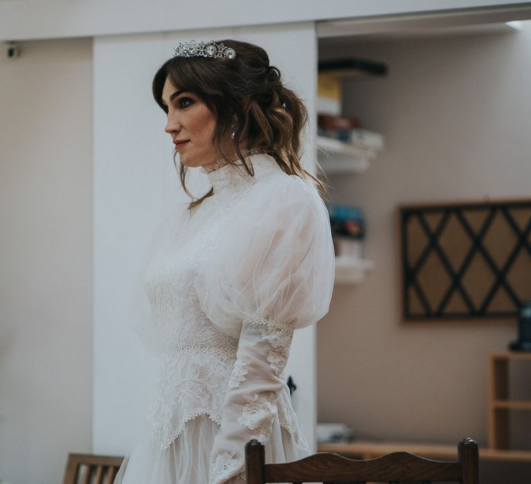 Bride wears gothic fairytale wedding gown complete with full sleeves 