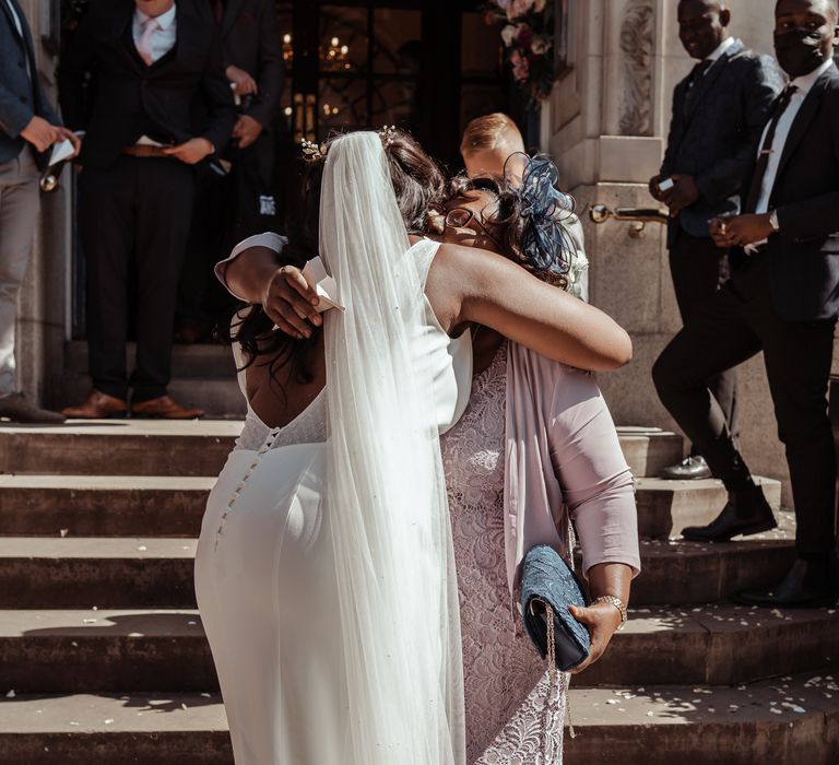 Bride hugs her mother on her wedding day | Imogen Eve Photography