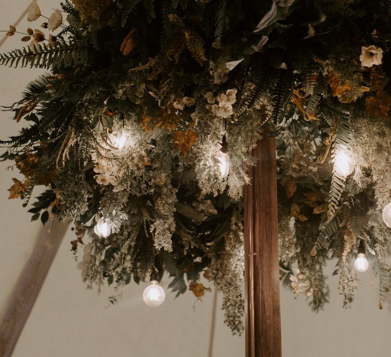 Florals complete with festoon lighting within