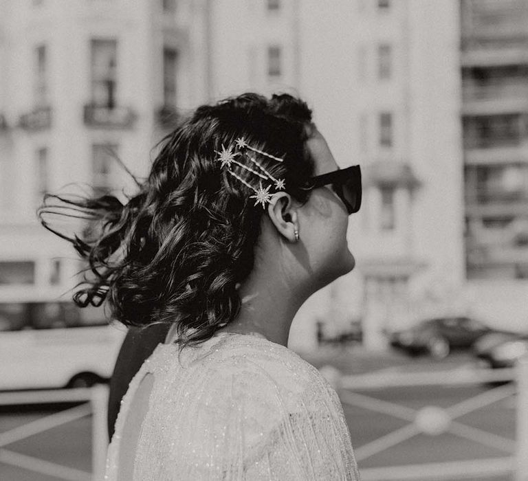 Bride wears star hair accessories holding her hair back