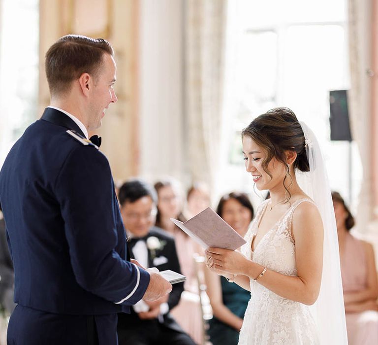 Bride & groom during wedding ceremony at Danesfield House