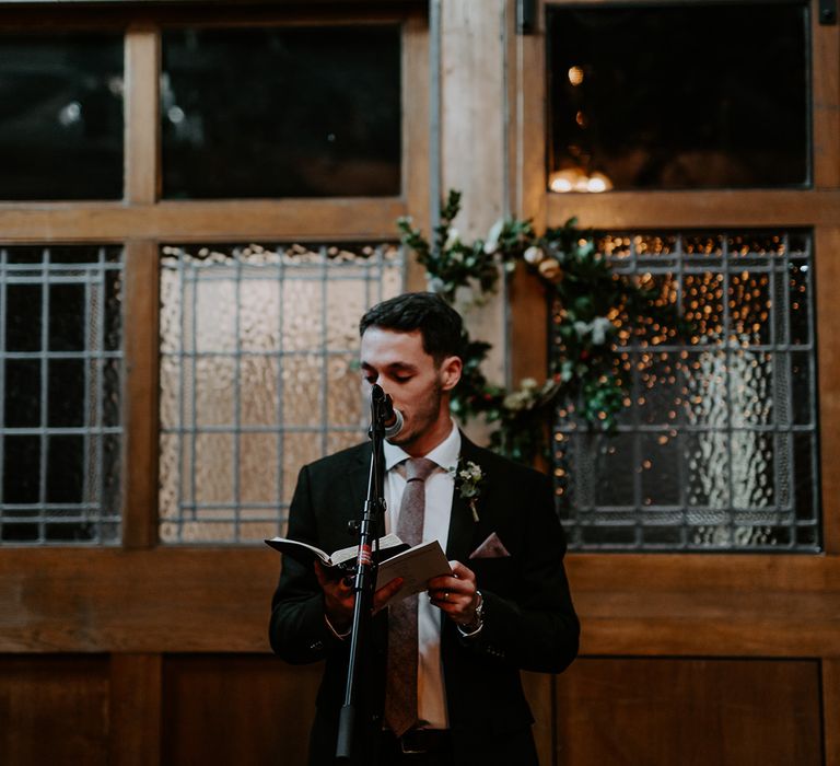 Wedding guest reads on wedding day