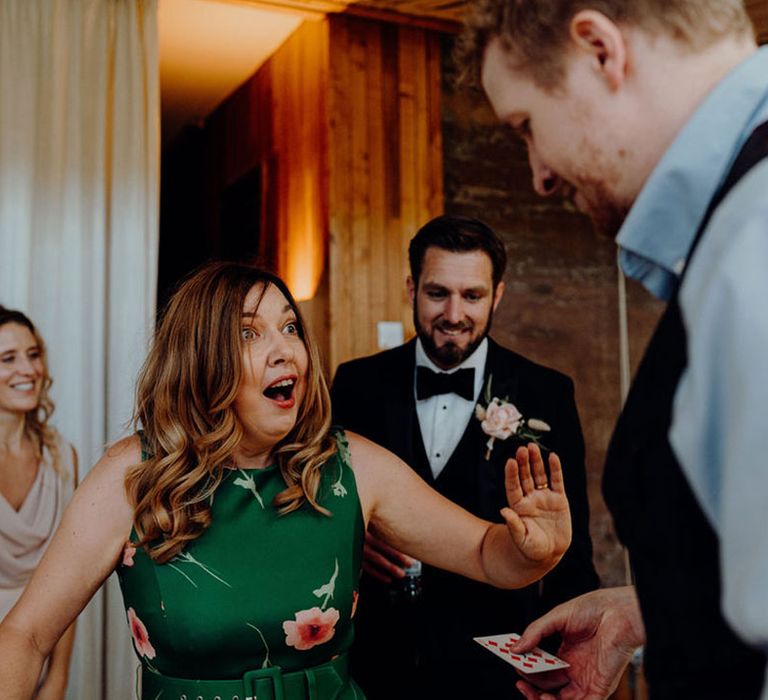 Magician wedding entertainer performing to guests at Elmore Court Wedding