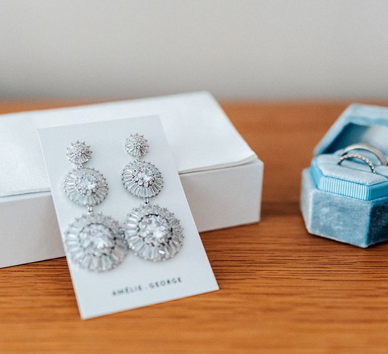 Amelie George silver statement earrings with blue velvet ring box with the wedding rings 