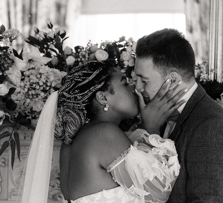 Bride and groom share their first kiss as a married couple