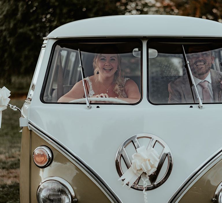 VW camper van wedding transport complete with white ribbons 