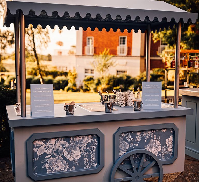 An ice cream cart for outdoor summer wedding celebrations 