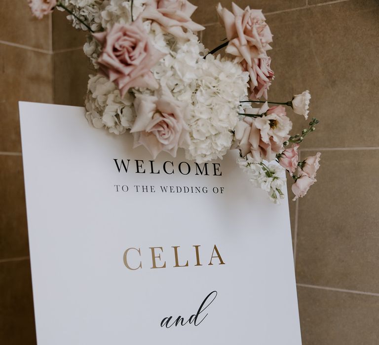 Minimalist wedding welcome sign with pastel neutral wedding flowers