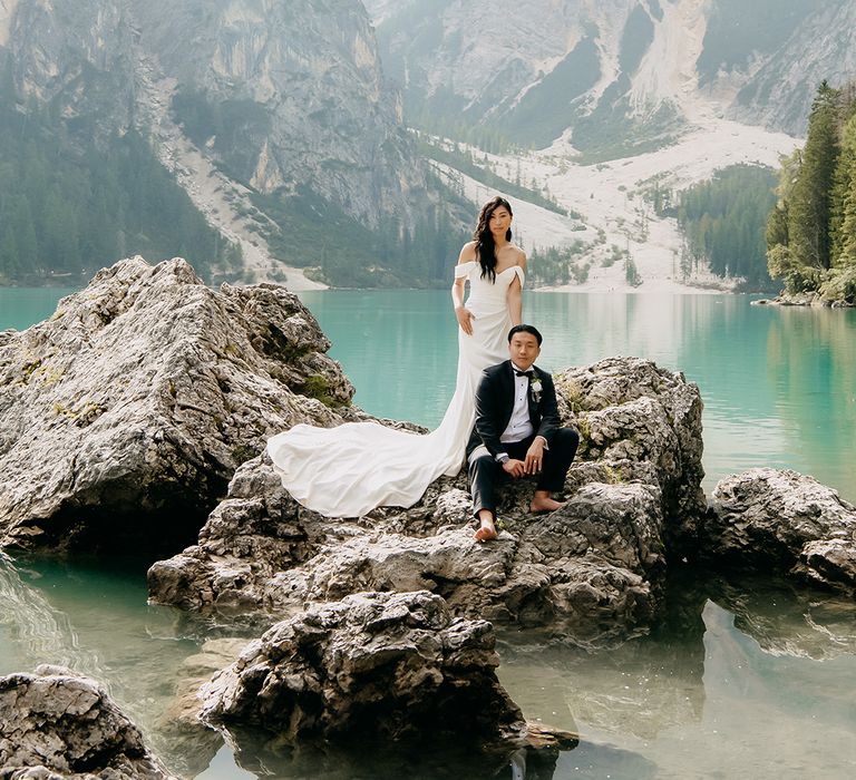 Destination wedding backdrop for couple portrait in classic black tie 