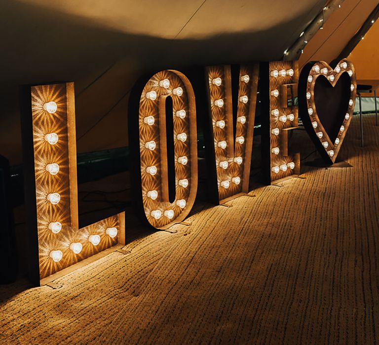 LOVE letter lights on the dance floor for wedding decor - Valentine's Day wedding ideas 