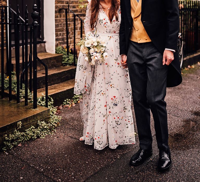 Groom in three piece morning suit gaze at the bride at London wedding at The Crypt On The Green