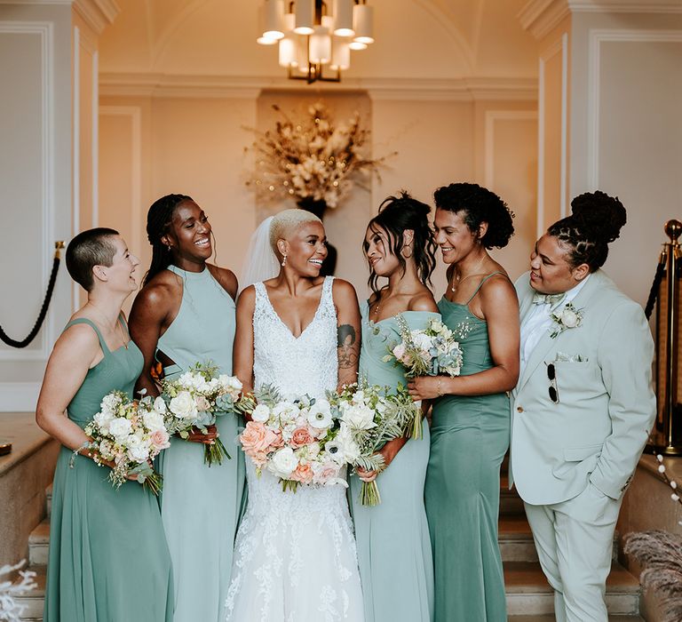 Bridal party wearing green wedding outfits for mixed gender wedding party 