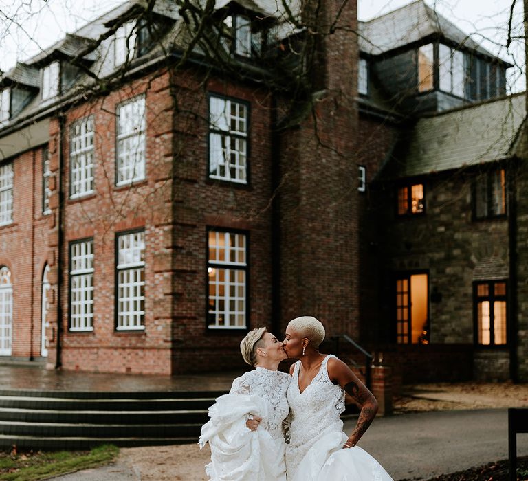 Sant Ffraed House country house luxury wedding venue in Wales with two brides kissing at same sex wedding 