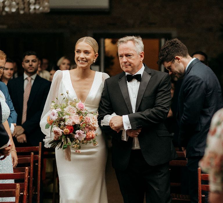 Father of the bride walks the bride down the aisle at 100 Barrington wedding 