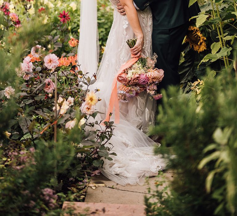 Romantic kiss for the bride and groom on wedding day 