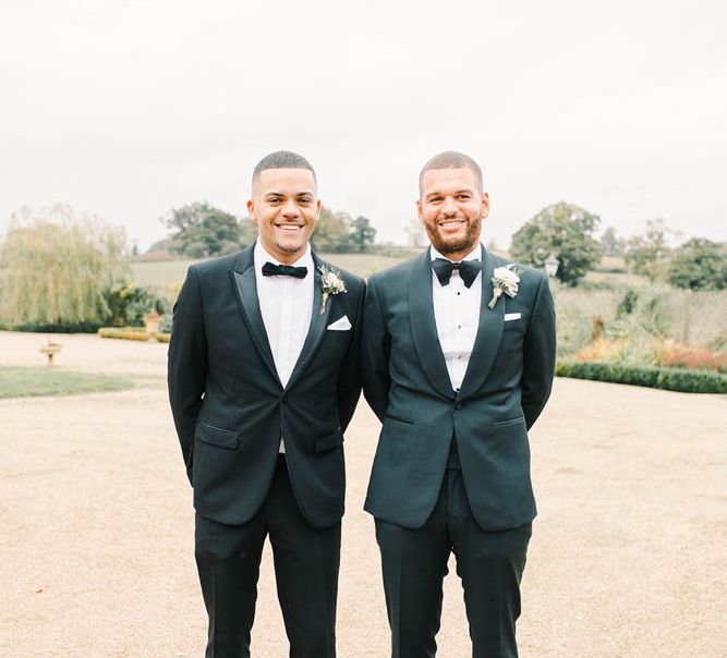 Groom and best man in tuxedos