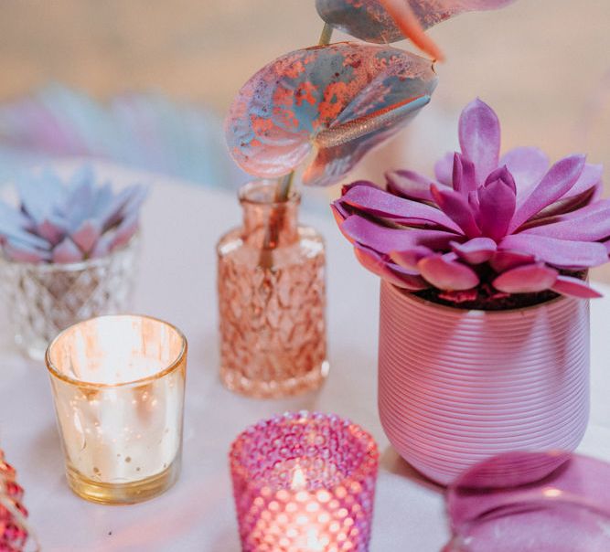 Spray painted cactus and anthuriums in vases 