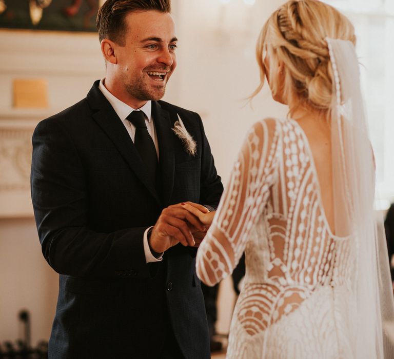 Bride and groom exchanging vows at Registry Office wedding 