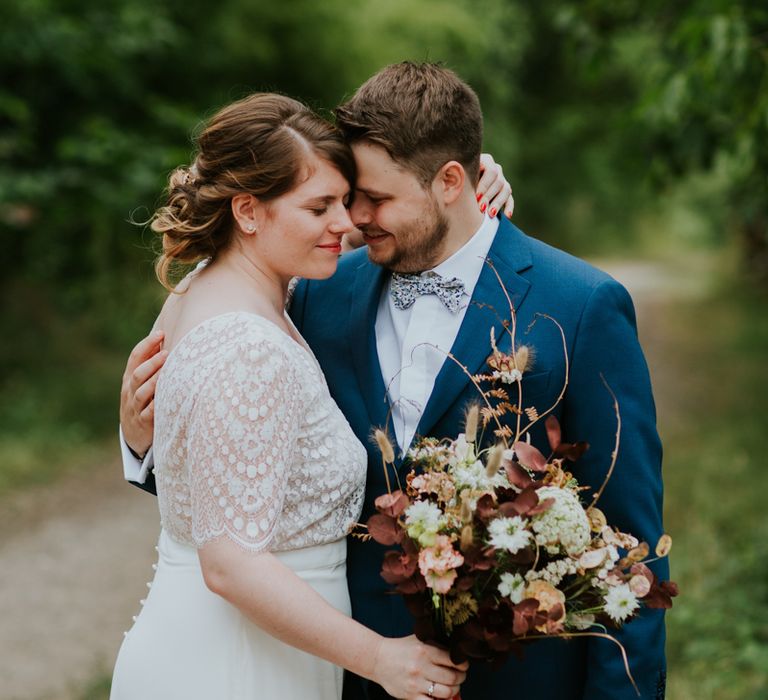 Bride and groom wedding photo by Photography By Chloe 