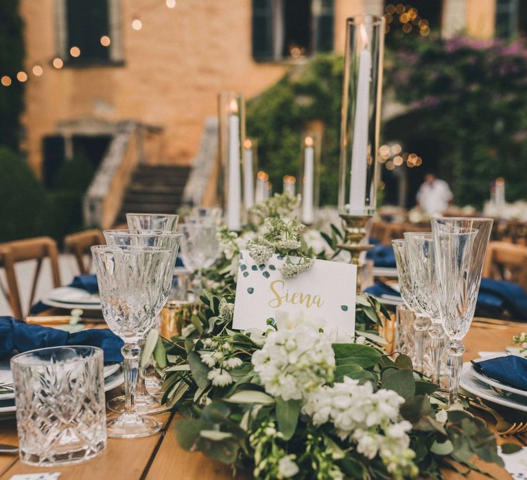 Stunning table setting with crystal cut glassware for Tuscany Italy Wedding