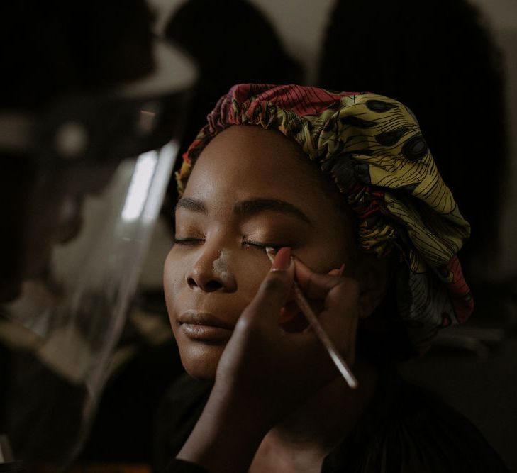 Black African bride having her makeup done 