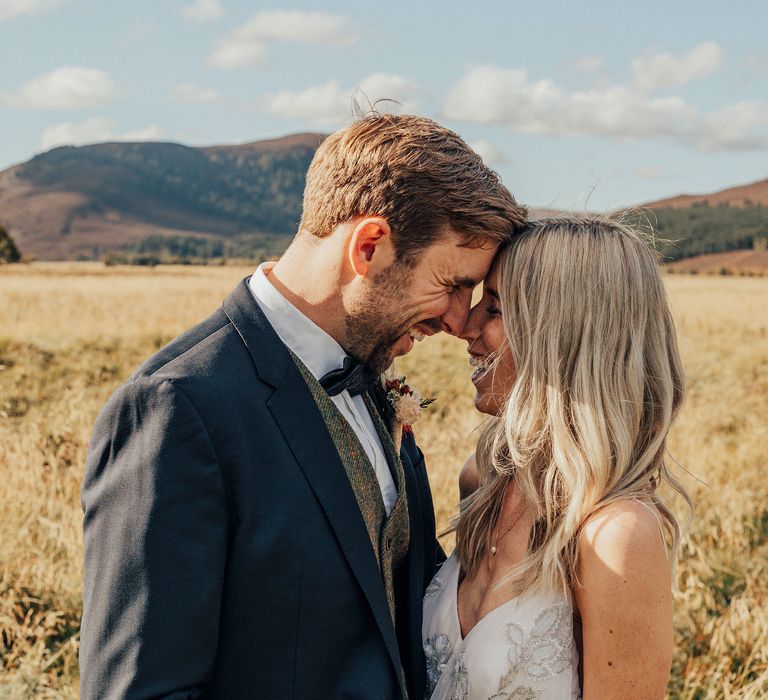 Bride & groom kiss in the Scottish countryside