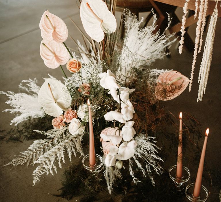 Neutral boho wedding flowers with orchids, anthuriums and pampas grass