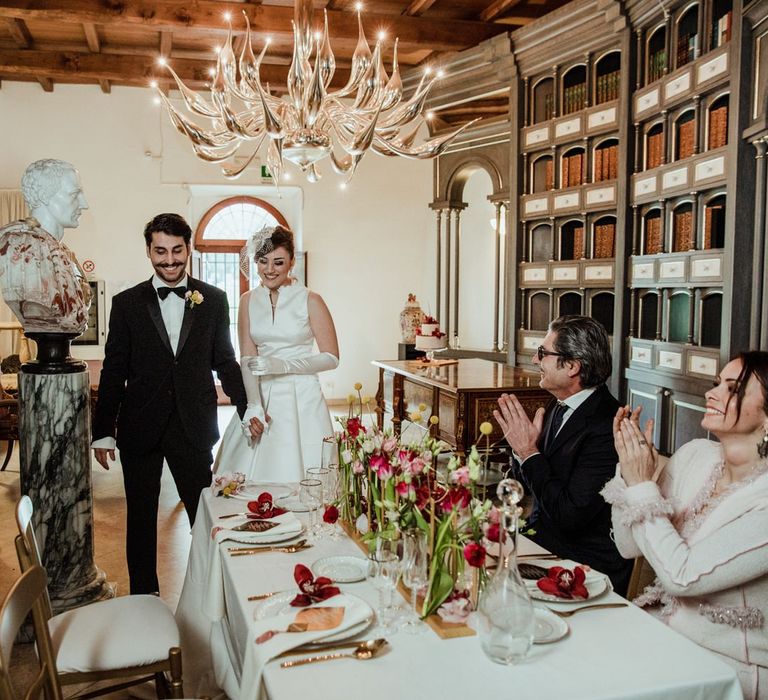 The bride and groom entering their intimate reception meal for four at Boscolo Circo Massimo