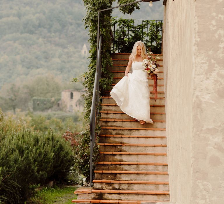 The bride walking down the stairs to make her entrance