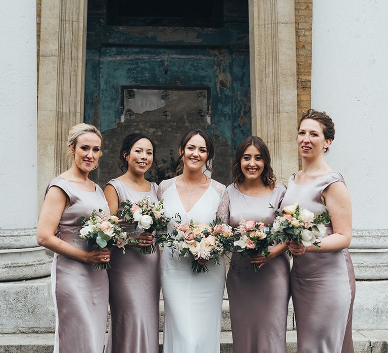 Bridesmaids in dusky pink satin bridesmaid dresses by Ghost at Town Hall wedding 