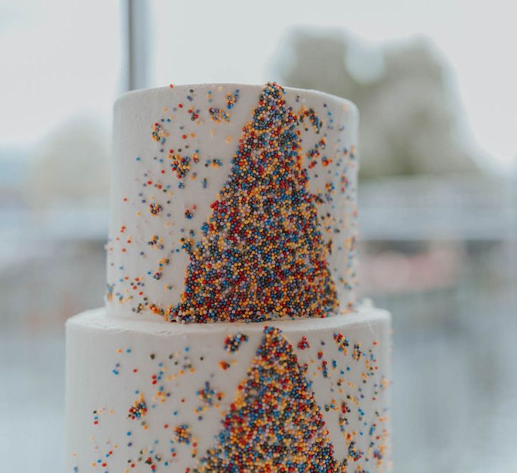 Hummingbird Bakery wedding cake complete with colourful hundreds and thousands decoration  | Kim Williams Weddings