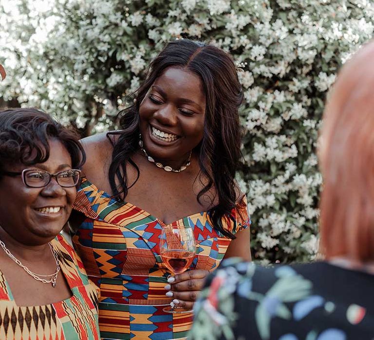 Wedding guests celebrate at Airbnb reception party outdoors