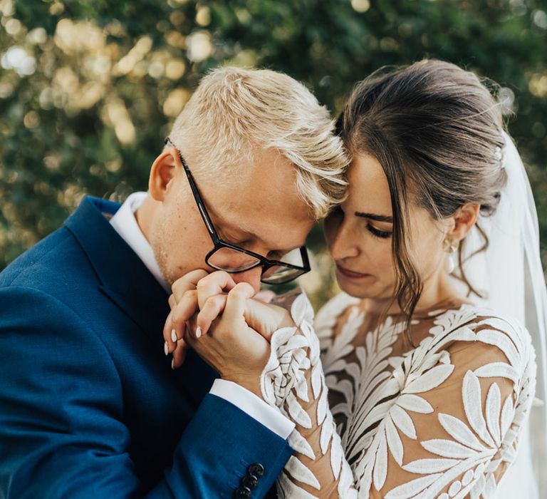 Boho Bride & Groom hold hands at unplugged ceremony 