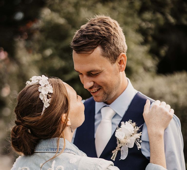 Bride & groom look lovingly at one another on their wedding day