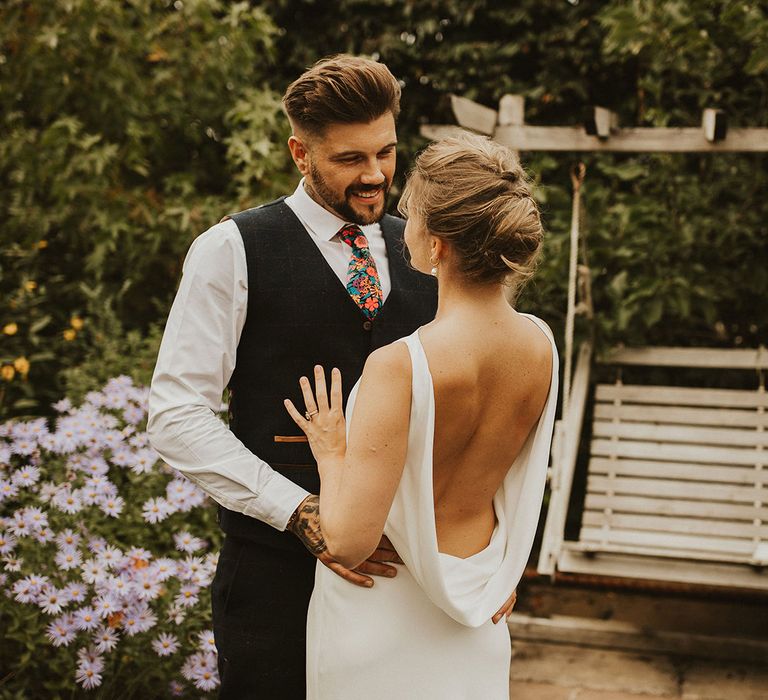 Charlie Brear cowl back wedding dress and pinned up do at back garden wedding