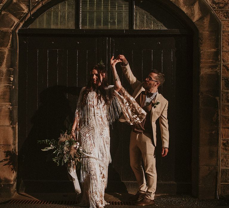 Bride & groom dance outdoors on their wedding day after ceremony