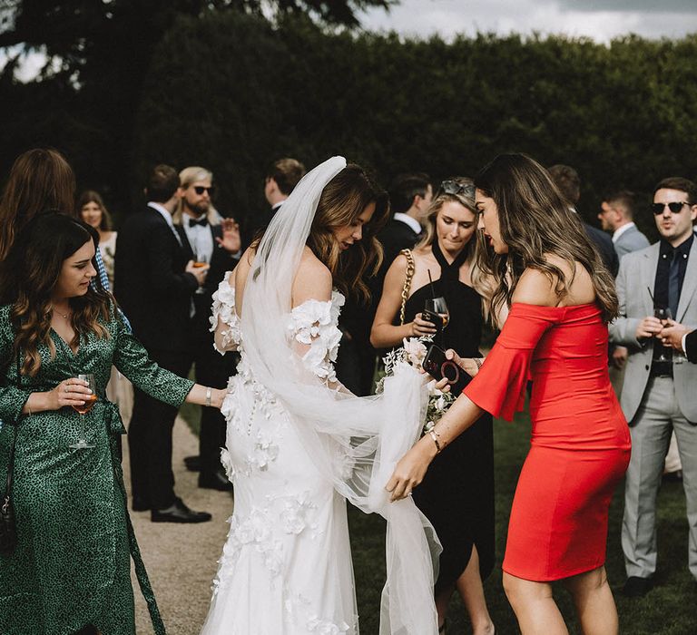 Applique wedding dress from Emma Beaumont with veil