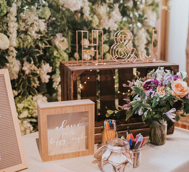 Wedding guest book and advice box for the bride and groom with wooden crates and personalised wired initial sign 