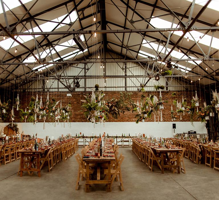 Warehouse wedding venue in Sheffield with DIY hanging plant decor with macrame