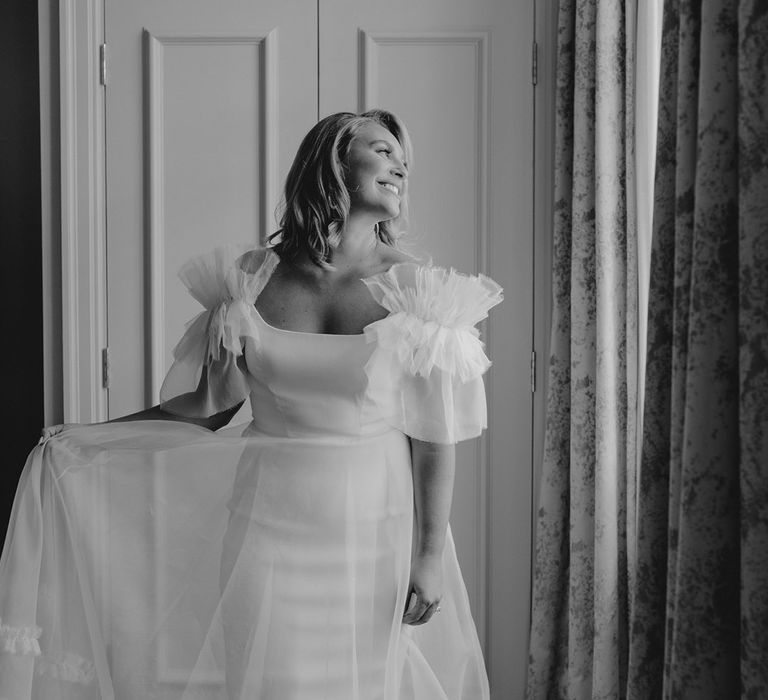 Ruffle sleeves and skirt Halfpenny London wedding dress on bride 