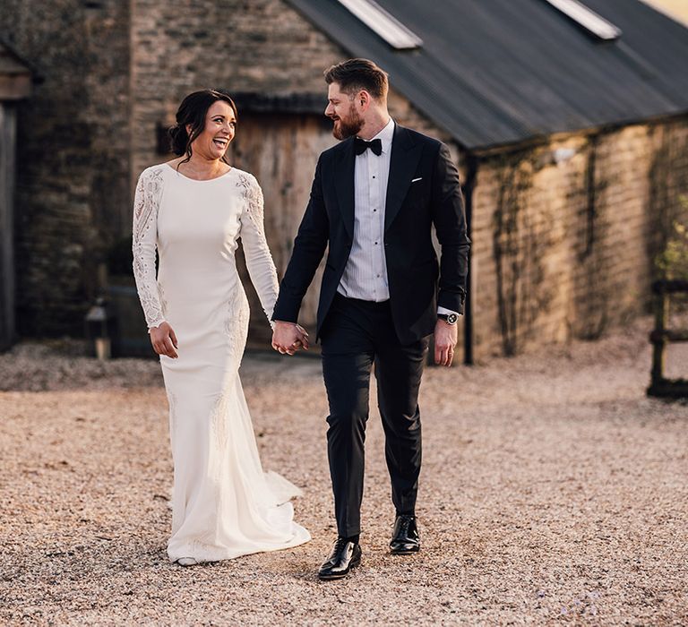 Bride and groom spend time alone together as they walk around Cripps Barn